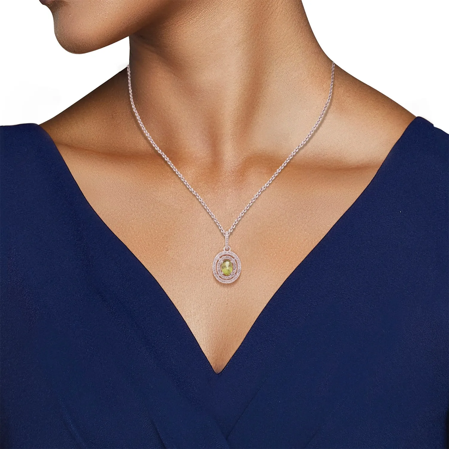 Jewelili Sterling Silver with 7x5 MM and 5X3 MM Oval Shape Peridot, Round Created White Sapphire and Natural White Round Diamonds Ring, Pendant and Earrings Set